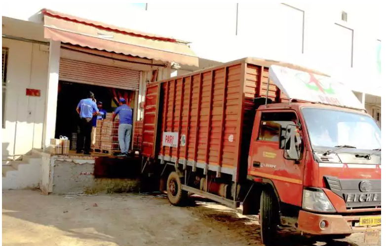 Self Storage India - Red transport truck at loading dock